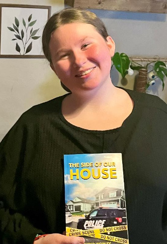 Pyper with her book "The Side of Our House"