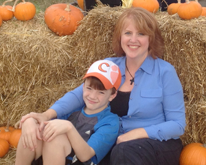 Cathy and her son at a pumpkin patch