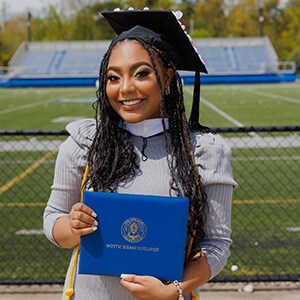 Amber holding her diploma