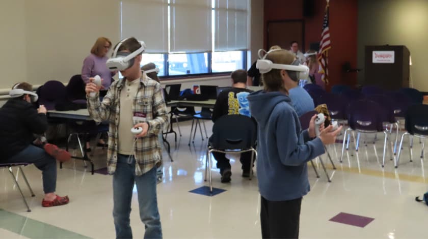 Two students wearing VR headsets at a VR field trip day