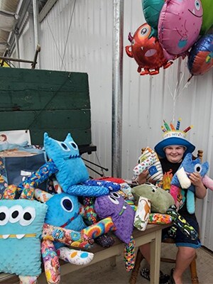 Image of Ben L, a student at Oregon Connections Academy with his worry monster stuffed dolls.