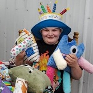 Image of Ben L, a student at Oregon Connections Academy with his worry monster stuffed dolls.