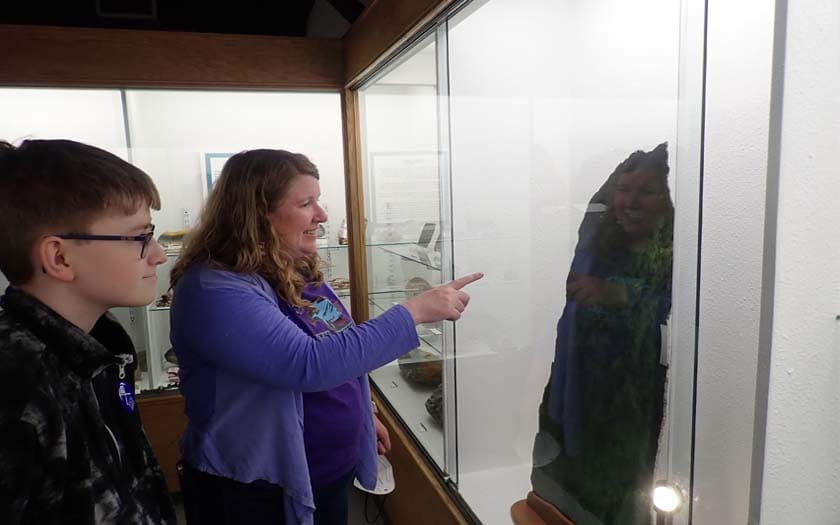 WillCA student looking at an exhibit.