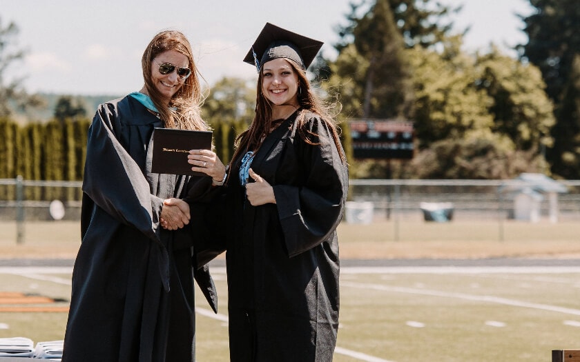 WillCA graduate walking the stage to receive diploma