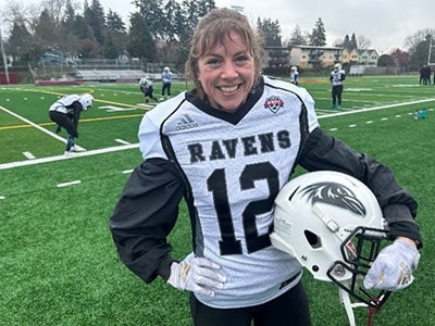 Image of Kelly Shaeffer playing football for the Ravens.