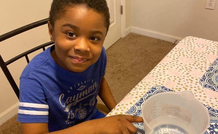 Brycen, a student at South Carolina Connections Academy is pictured here using a measuring cup.