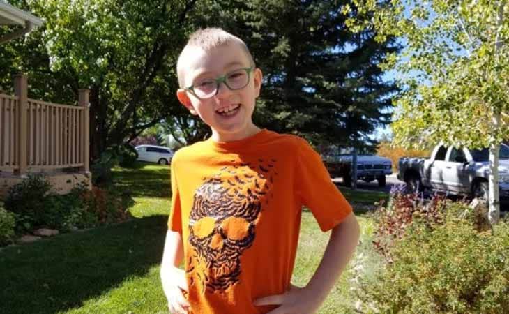 Aiden from Wyoming Connections Academy wearing an orange shirt