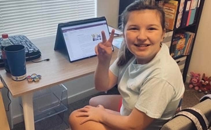 Marley from Virginia Connections Academy smiling giving the peace sign. 