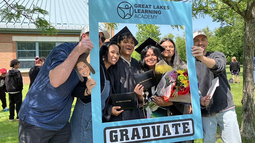 Graduates of GLLA pose for a picture with family