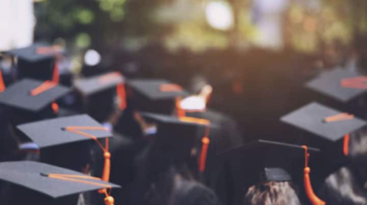 Students graduating and celebrating together