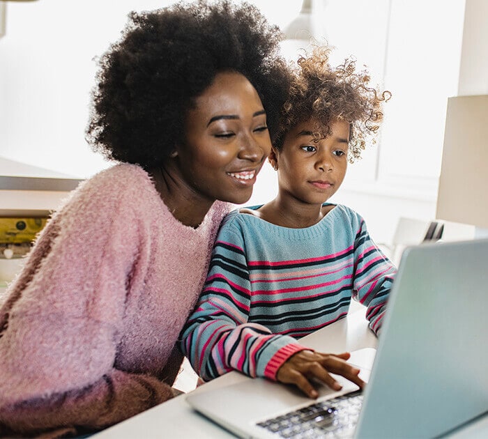 Mother and daughter studying together on a laptop - Connections Academy