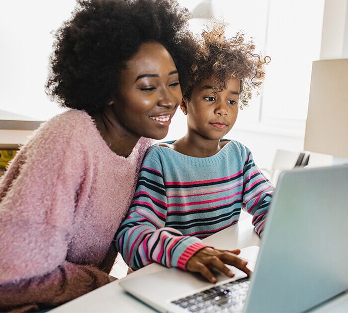 Parent helps her daughter with online elementary school courses - Connections Academy