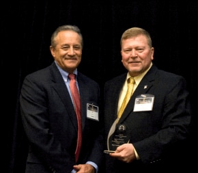 An Ohio Connections Academy teacher holding an award