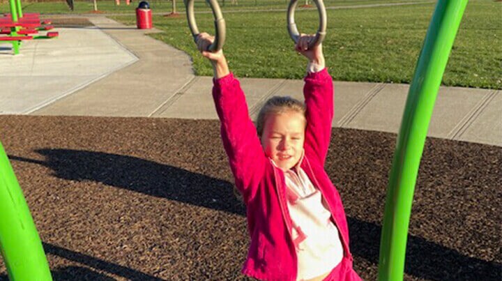 Ava playing on the playground