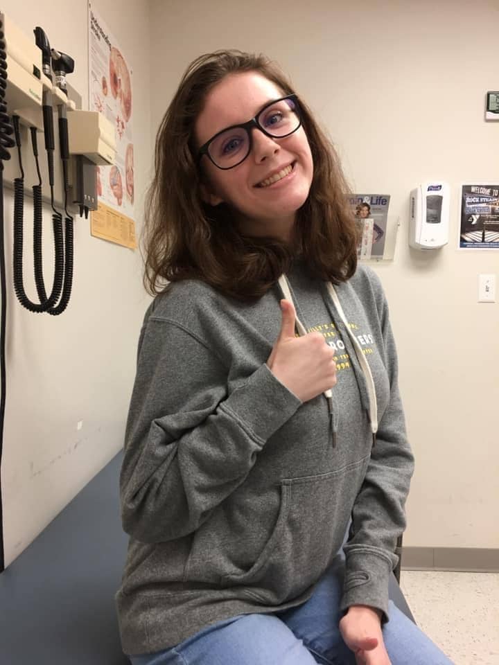 Hannah smiling at a doctor's office