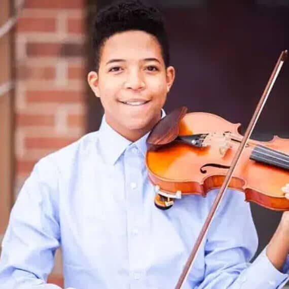 Connections Academy student Leon with his violin. 