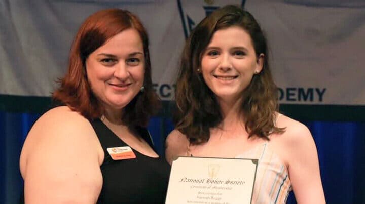 Hannah holding a National Honor Award