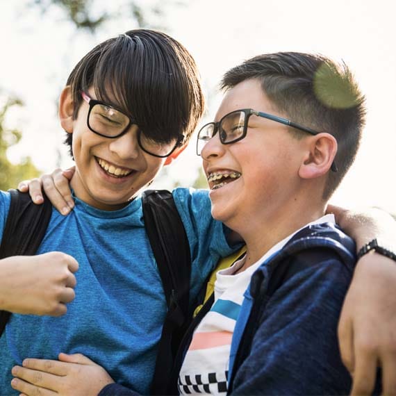 Two boys laughing together