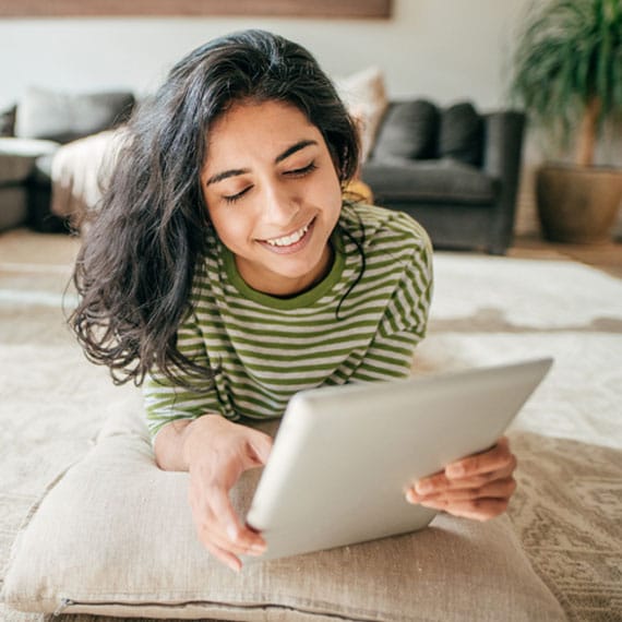 Caucasian female high school student doing schoolwork online - Connections Academy