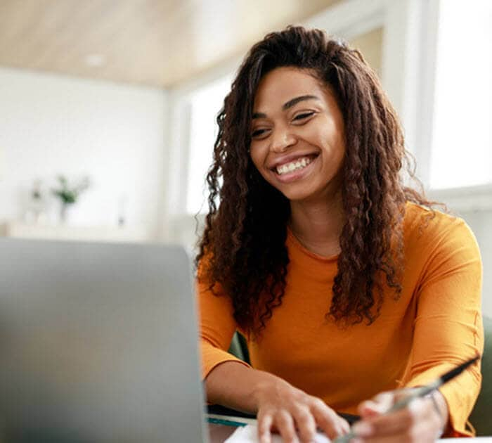 A Connections Academy parent is writing down the Connections Academy phone number