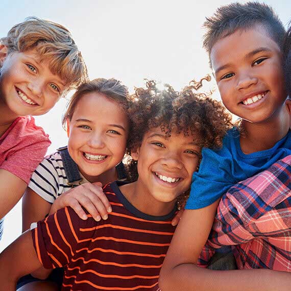 Diverse group of young students smiling at camera - Connections Academy