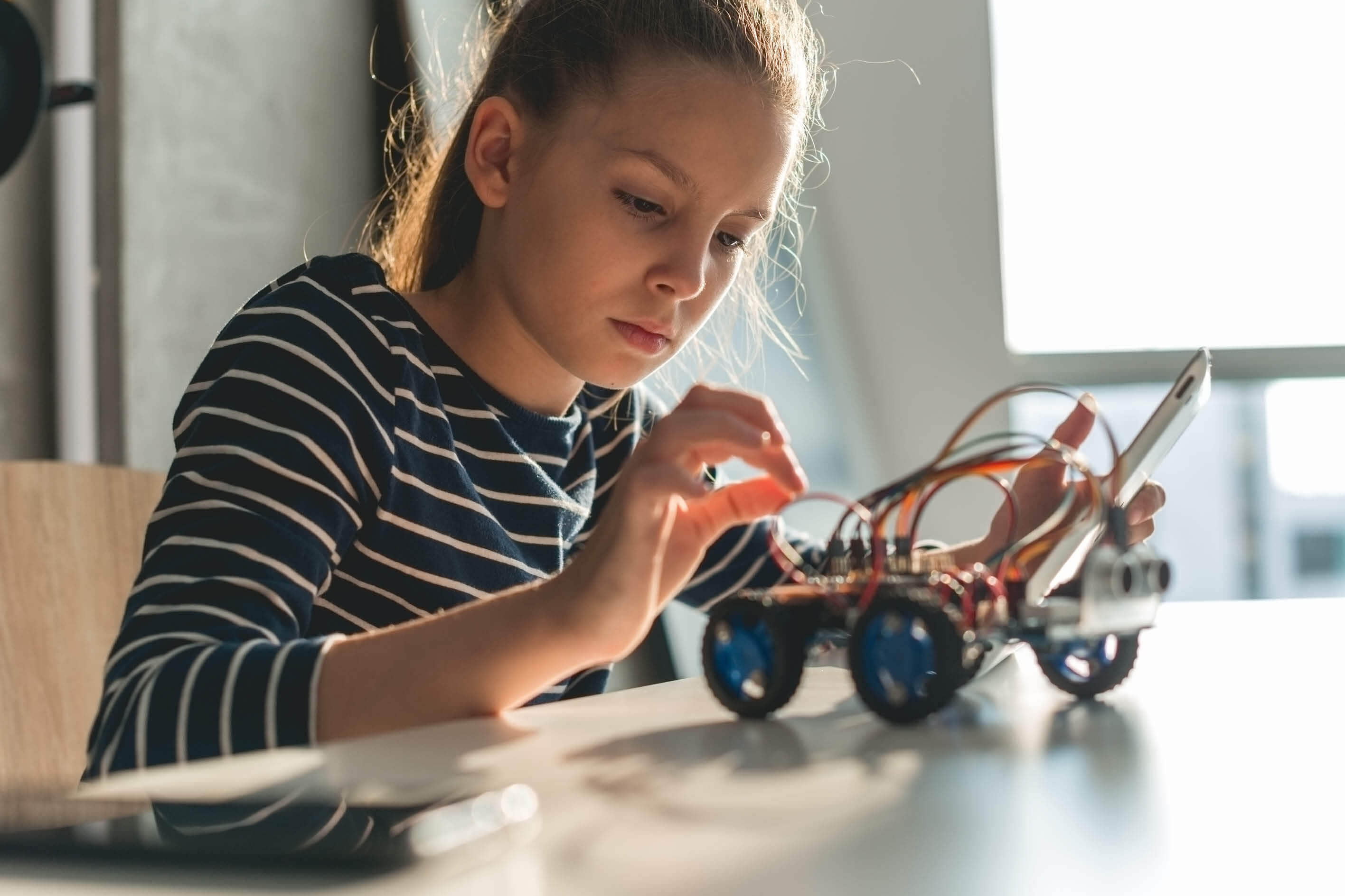 Young girl engaging in STEAM activity