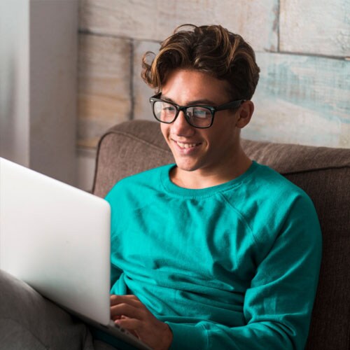 Caucasian female high school student doing schoolwork online - Connections Academy