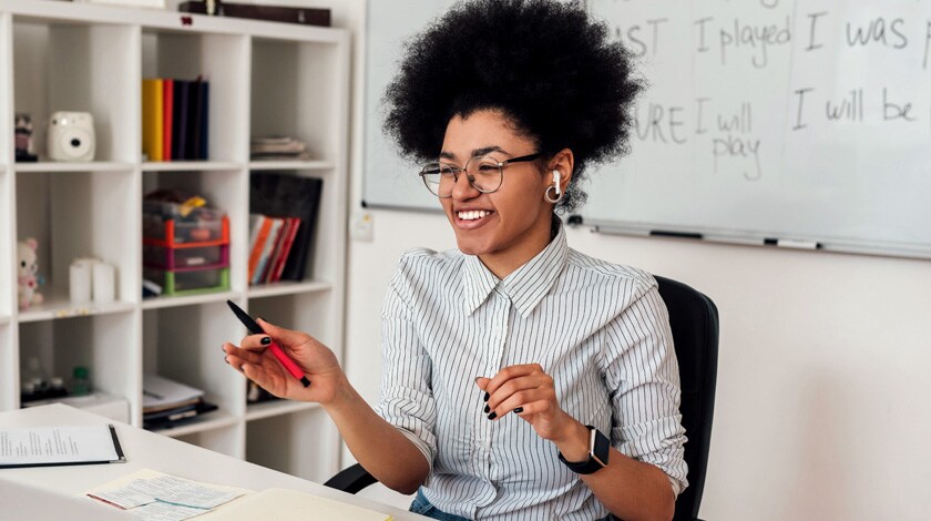 African American tutor instructing during an online session - Connections Academy