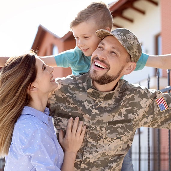 A military family smiling together - Connections Academy