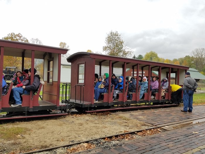 Students bundle up for a chilly train ride at the Hesston Steam Museum
