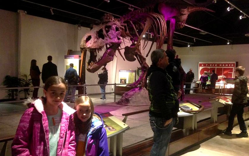 Amalia and Elisa Iftinchi in front of the largest complete T-Rex fossil on record at the Discovery Center of Idaho Field Trip