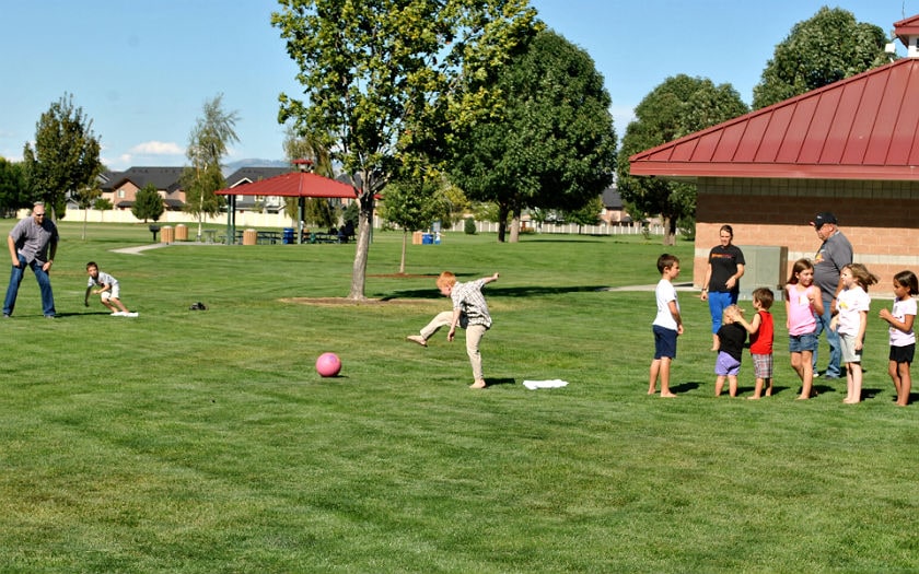 Students playing Kickball at Inspire’s Back to School Olympics event