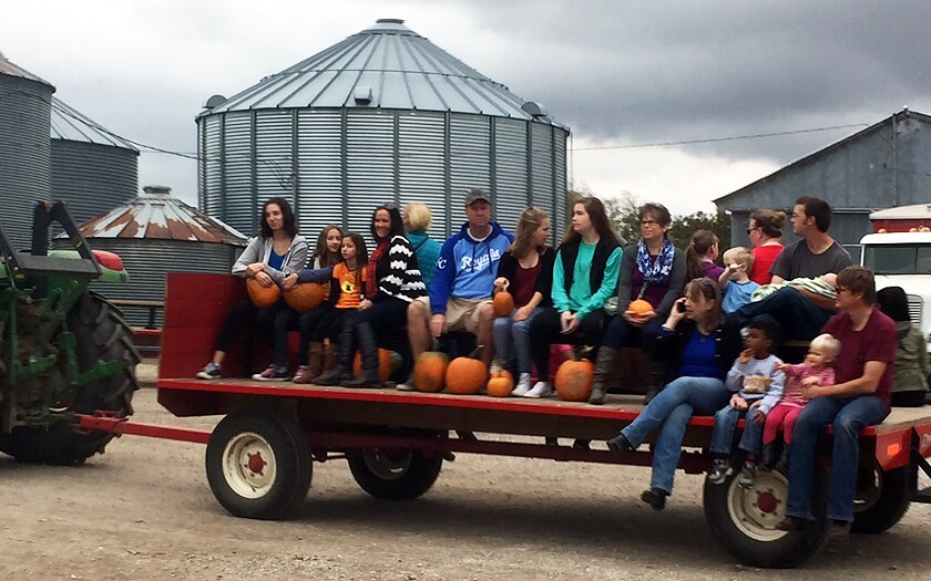 Studnets having fun at a school social at a pumpkin patch