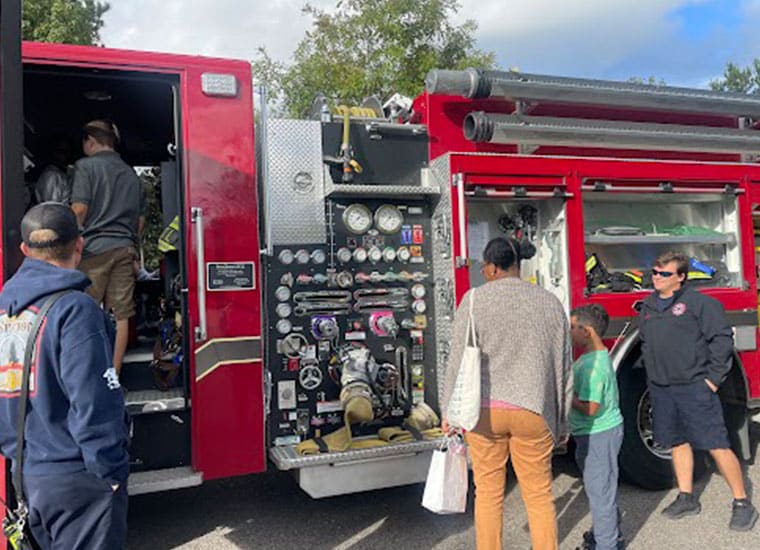 Students gathered by a firetruck