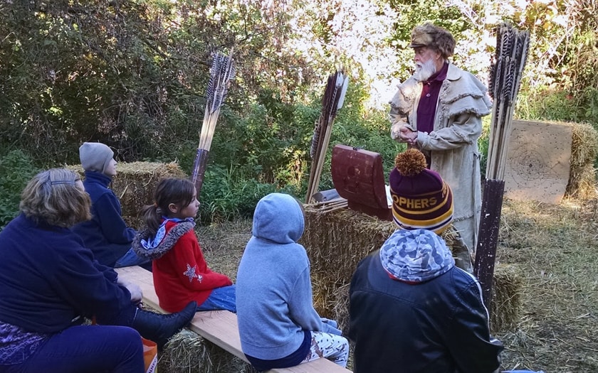 Students learning about the atlatl