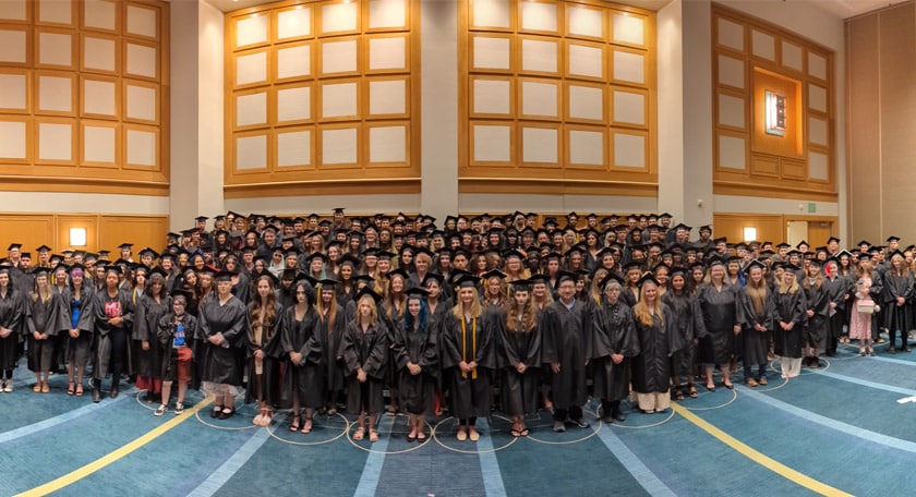 Diverse group of students in their graduation outfits - Connections Academy