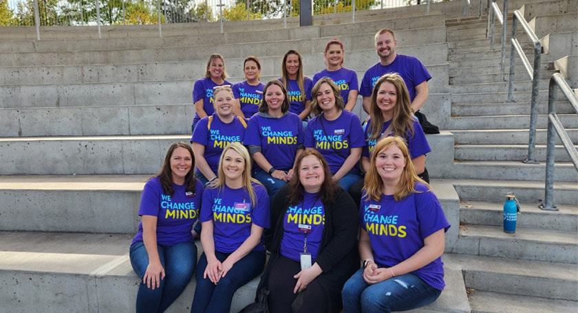 Minnesota Connections Academy staff wearing purple Connections Academy tshirts together