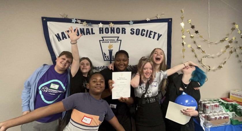 A group of NHS students smiling