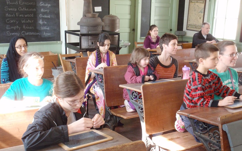 Students visit a one-room school house in Olmsted County