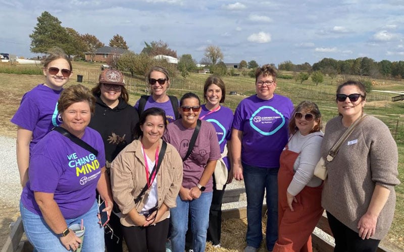 Staff gathered together on a field trip to Peachtree Farm for Missouri Connections Academy