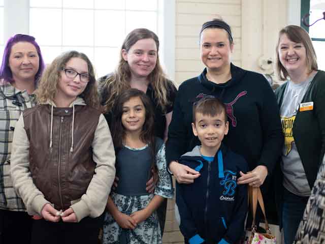 Families tour Mashougal Mill.