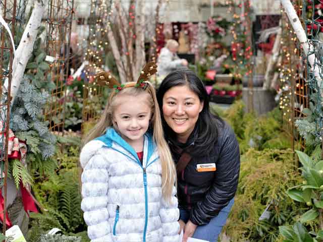 A student a staff member at Watson&#39;s Greenhouse