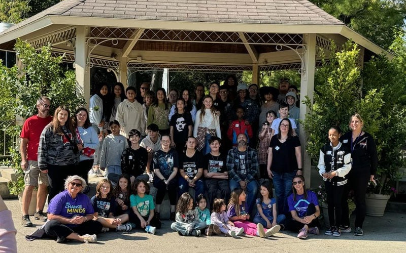 A group of people gathered under a pavilion