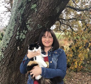 Destiny holding her cat