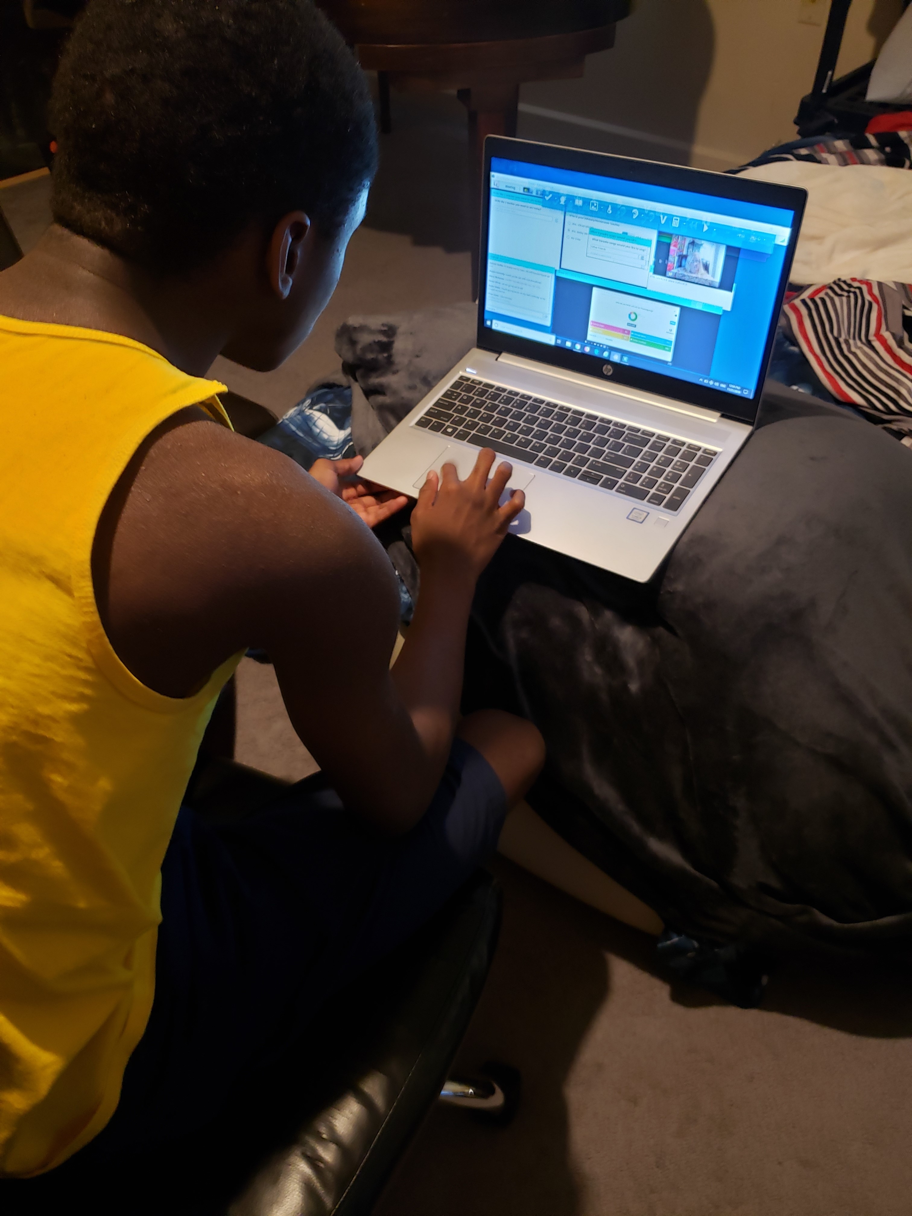 Michael attending online school on his laptop