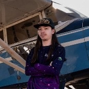 Matthias standing in front of a small plane
