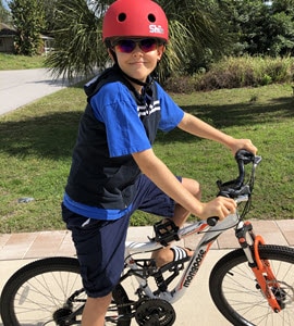 Daniel riding a bike