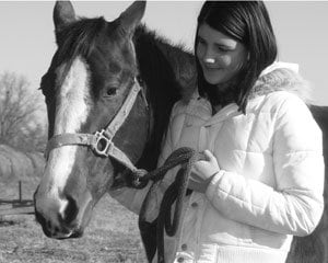 Grace walking a horse