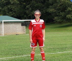 Pearl standing in a soccer field