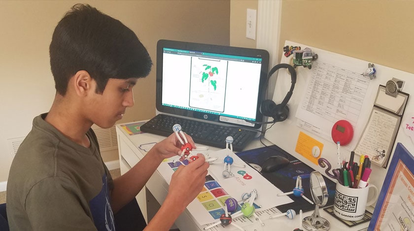 Absar at his desk attending online school